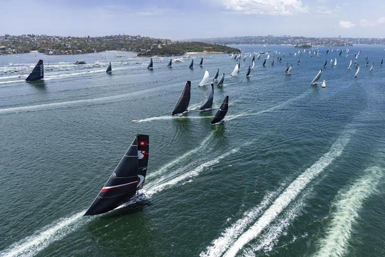 Two super maxis continue to lead the Sydney to Hobart race as storms hit fleet