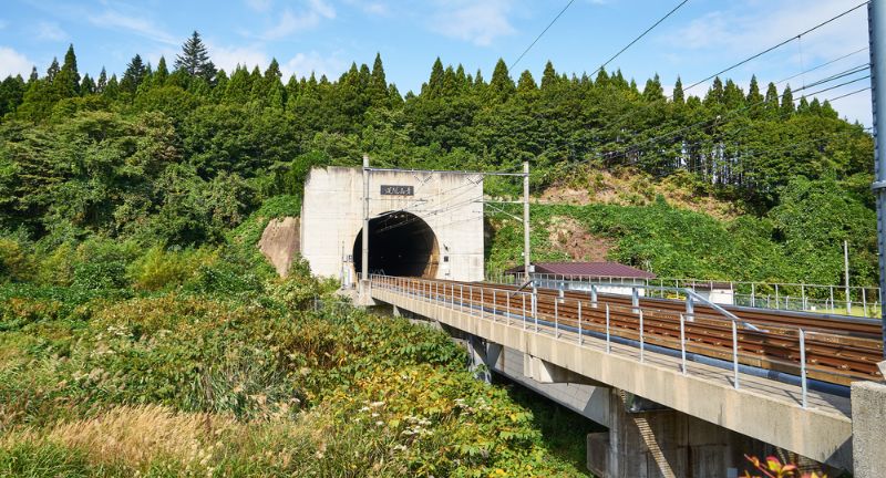 <p>Completed in 1988, the Seikan Tunnel is a railway tunnel that runs beneath the seabed of the Tsugaru Strait, connecting Honshu and Hokkaido islands in Japan. Extending over 14.5 miles (23.3 km), it is the second longest tunnel of its kind in the world.</p>