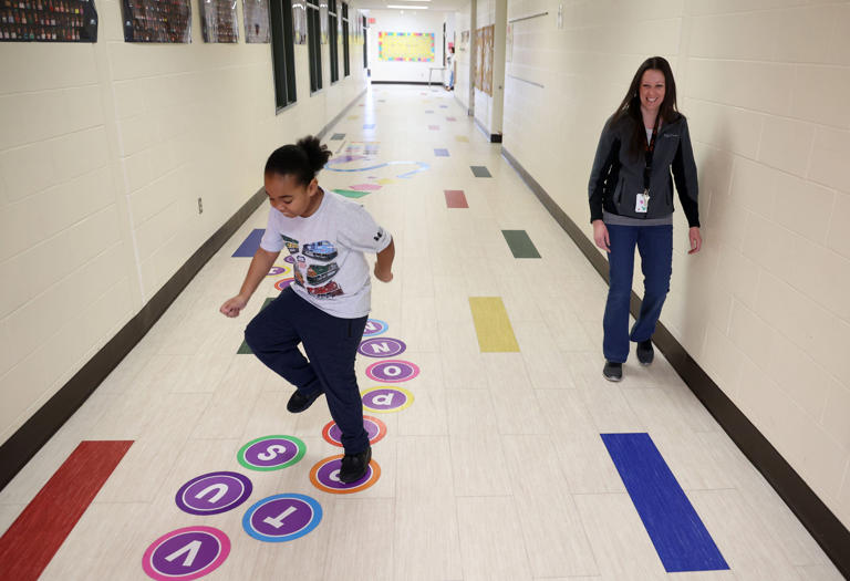 A student plays on the sensory path at Gwendolyn Brooks Elementary in DeKalb on Dec. 14.
