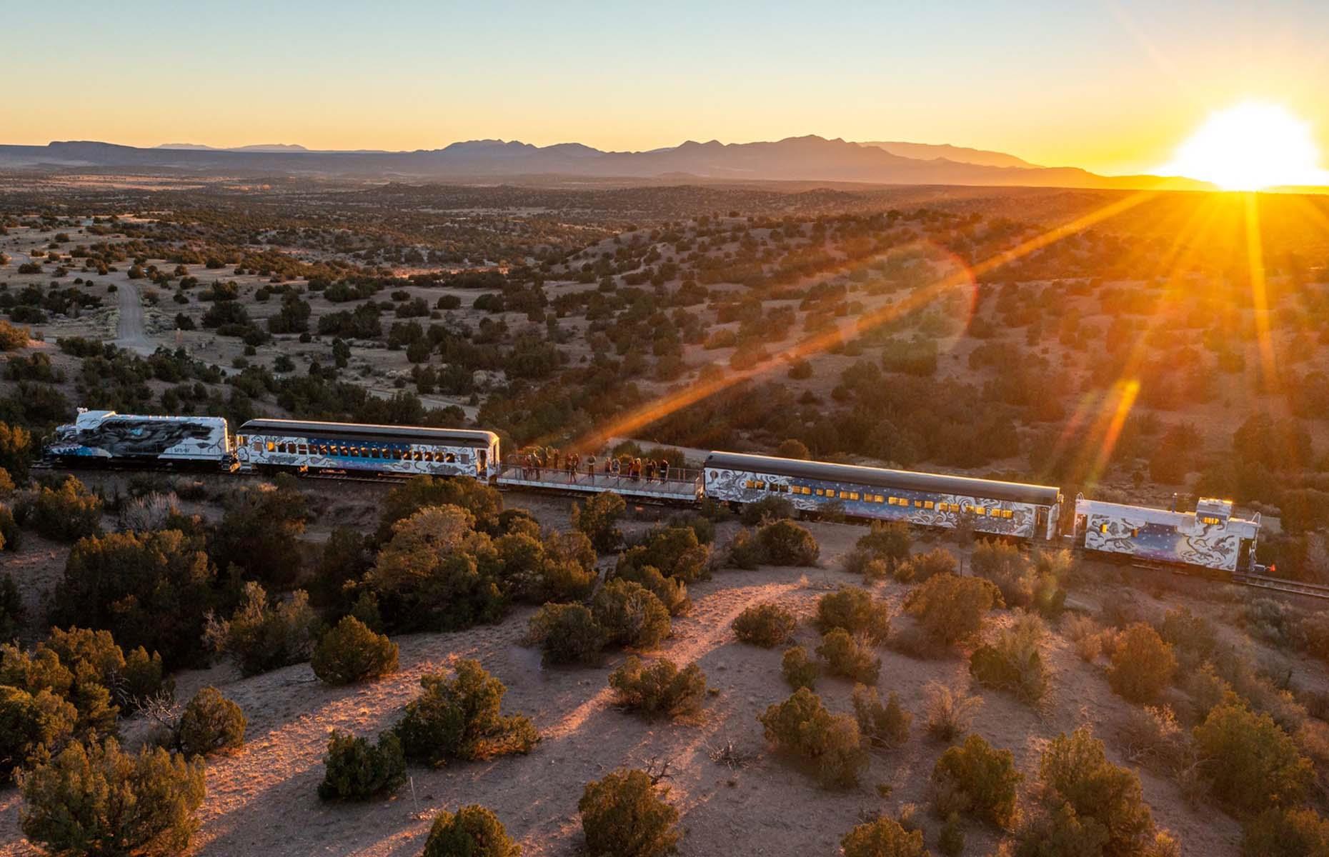 <p>Passengers on New Mexico’s Sky Railway are walking in the footsteps of Hollywood icons Judy Garland and Clark Gable by riding the heritage line. For over 140 years, these tracks have swept travelers across the amber and olive-green landscapes between Santa Fe and Lamy.</p>  <p>There are a few different ways to enjoy the round-trip journey – the Stargazer experience unlocks the mysteries of the night sky above the Galisteo Basin, while the Sunset Serenade sets the coming of dusk to a soundtrack of live music.</p>