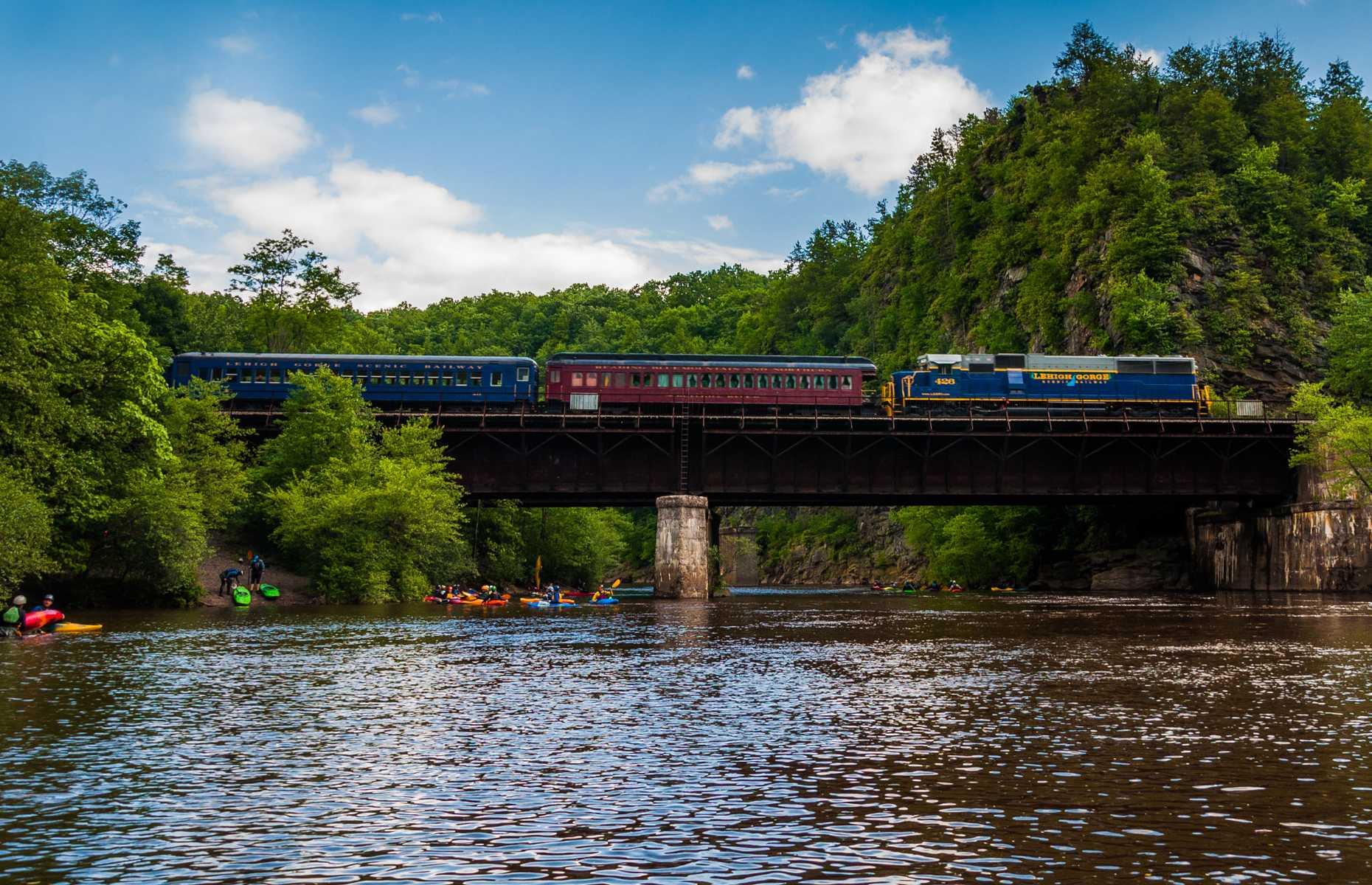 <p>This tourist train operates out of the historic town of Jim Thorpe, which has been called the Switzerland of America in its time. As its name might suggest, the Lehigh Gorge Scenic Railway is swaddled by towering cliffs, mountains, and abundant wildlife on its forested run to Old Penn Haven.</p>  <p>Featuring passenger cars that have been in service since as early as 1917, the train offers open-air, vista-dome, and standard coach seating on its narrated 70-minute round-trip journeys.</p>