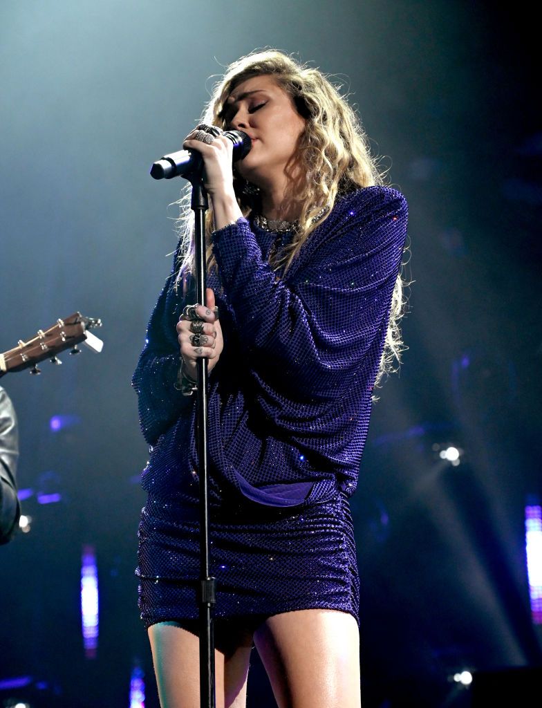 <p>Miley wore a gorgeous sparkly purple minidress during her tribute to Chris Cornell, who passed away in 2017.</p>