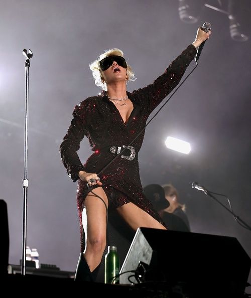 <p>Miley rocked Texas in this sparkly dress which had a fun reveal when she whipped the train off to reveal a leotard.</p>