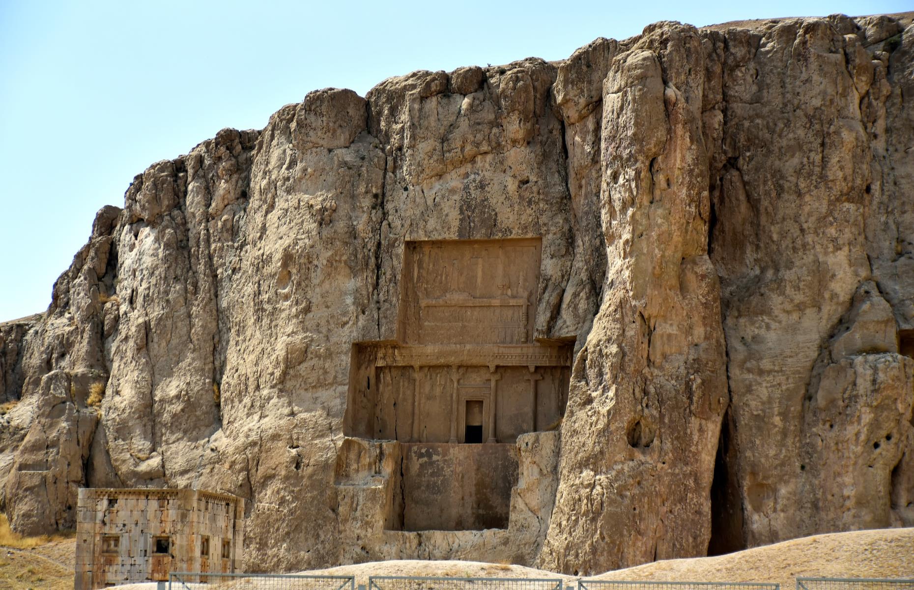 <p>Exquisite relief carvings adorn panels above the openings of each tomb which date back to the 4th and 5th centuries BC. Elsewhere large, carved rock reliefs are cut into the mountain façade. These richly decorated reliefs were carved by the Sasanians in the 3rd century AD to commemorate the battles of the Achaemenid dynasty. As well as being a royal necropolis, Naqsh-e Rostam (meaning Throne of Rustam) became a major ceremonial centre for the Sasanians until the 7th century.</p>