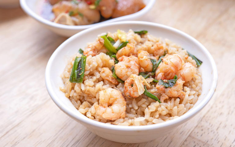 For a protein-packed lunch, try a prawn stir fry served with rice (140g prawns contains about 30g protein) - Getty Images