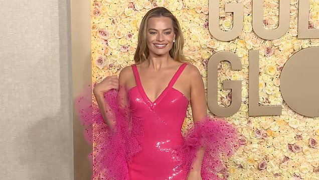 Margot Robbie Embraces Barbie On The 2024 Golden Globes Carpet