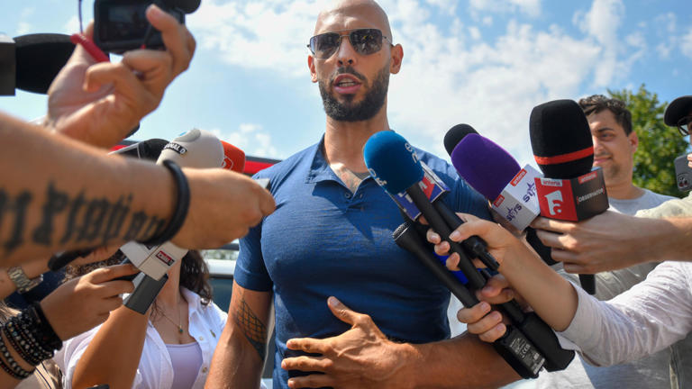 Andrew Tate speaks to media after being released from house arrest and put under judicial control measures, on the outskirts of Bucharest, Romania, Friday, Aug. 4. AP/Alexandru Dobre
