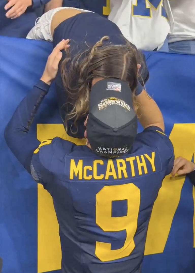 J.J. McCarthy kisses girlfriend after winning national championship