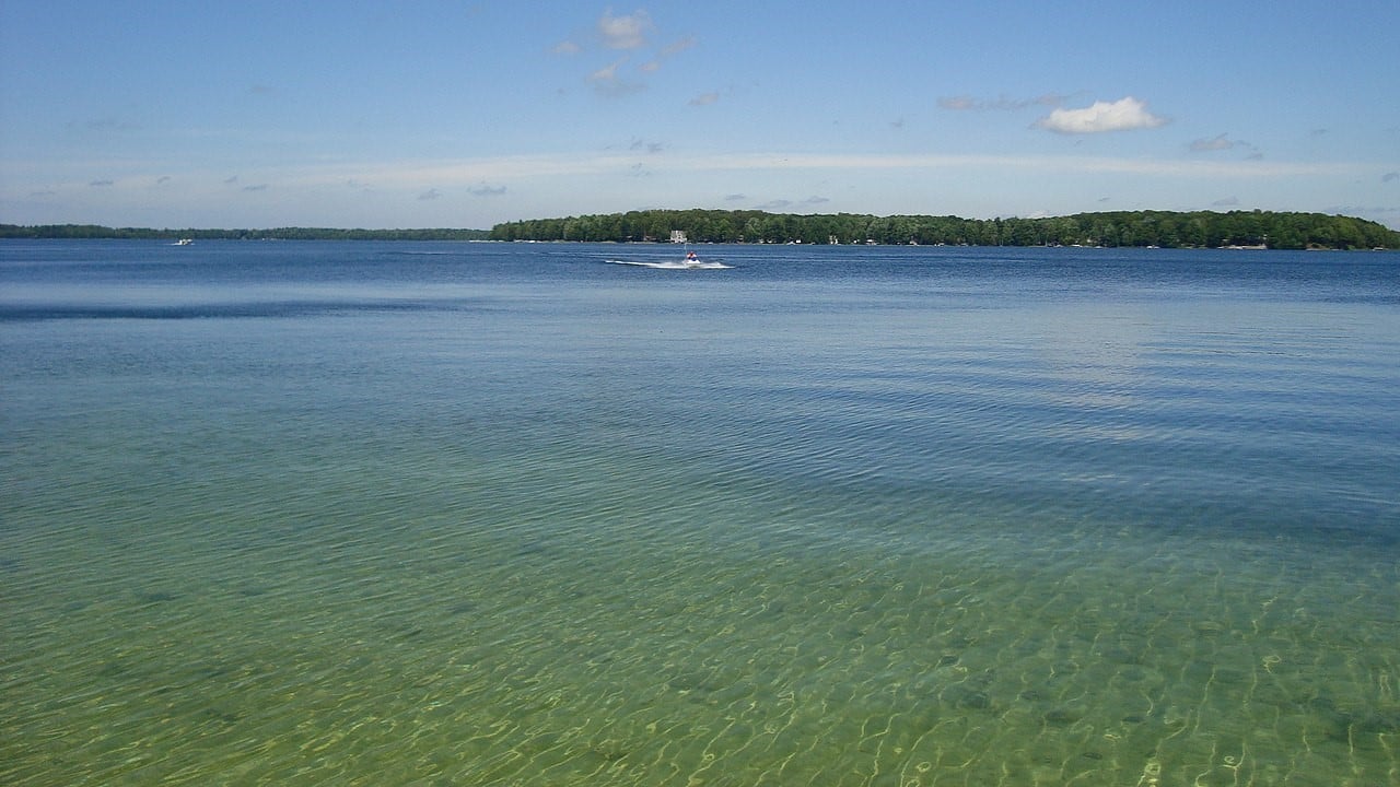<p>Traverse City, Michigan, is a great pick for beach lovers, right by Lake Michigan’s alluring Grand Traverse Bay. The city’s beaches, especially those on the Old Mission Peninsula, add to the charm with their gorgeous views and access to the Great Lakes. Whether you’re into soaking up the sun, taking a refreshing dip, or trying out water activities like kayaking and paddleboarding, Traverse City’s got it all! You could also visit the Sleeping Bear Dunes National Lakeshore, which features hiking trails and beautiful scenery.</p>