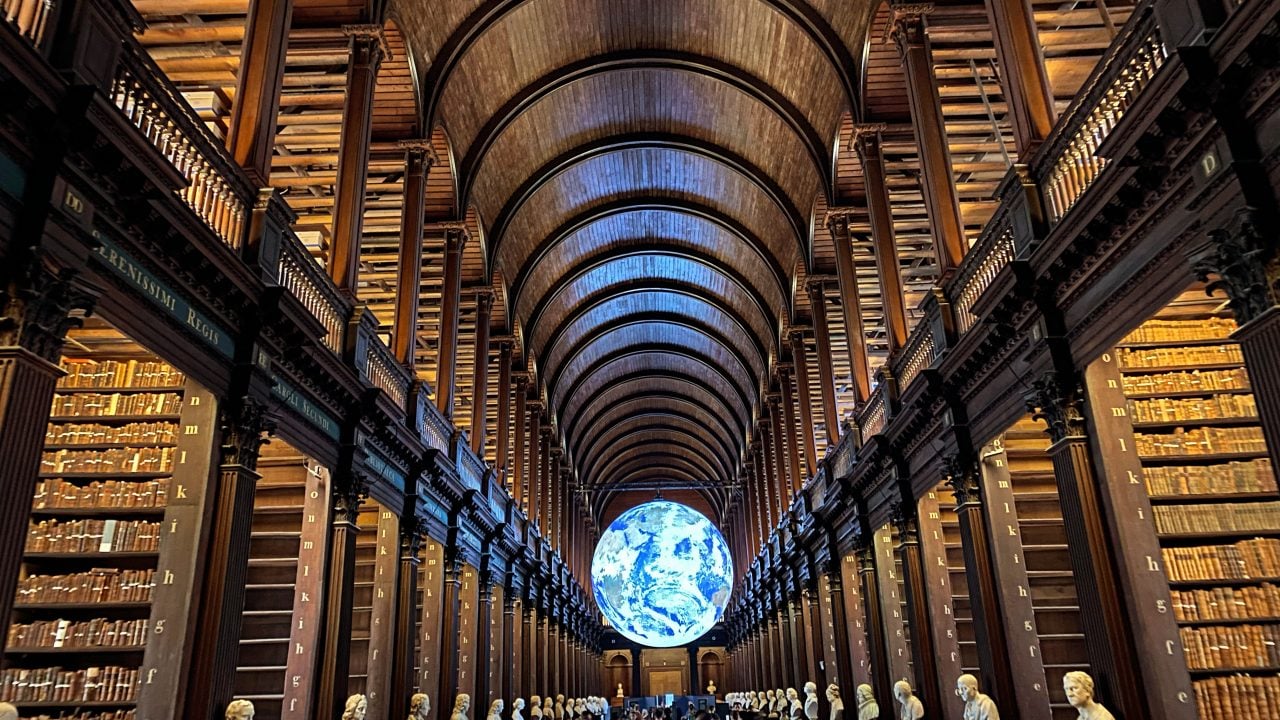 <p><a href="http://tcd.ie/" rel="nofollow noopener">Trinity College</a>’s library houses the <a href="https://www.visittrinity.ie/book-of-kells/" rel="nofollow noopener">Book of Kells</a>, a Celtic Gospel from the 9th century. Upstairs sits the Old Library’s famous and visually imposing long room, which displays one of the original printings of the 1916 Proclamation of the Irish Republic and “Brian Boru’s harp,” a medieval instrument that served as the model for both the Irish coat of arms and the trademark for Guinness.</p>
