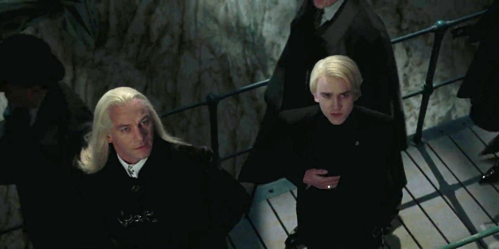 <b>Draco</b> and Lucius looking up at the Quidditch World Cup.