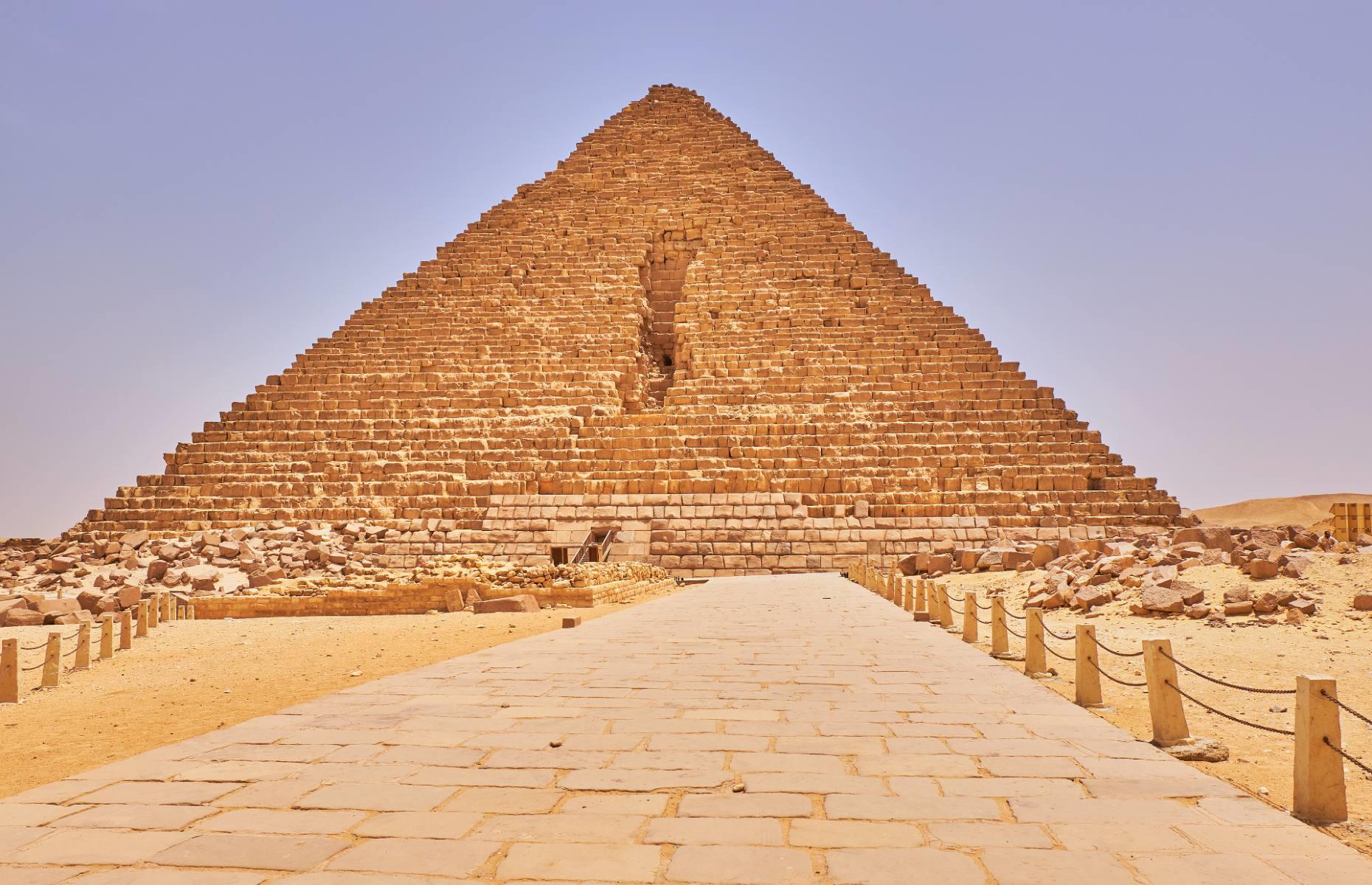 <p>The Menkaure Pyramid is the last and smallest of the three Great Pyramids of Giza, standing at just 213 feet (65m) tall. Completed in the 26th century BC, it was built for King Menkaure, and sits on the same plateau as the pyramids of his father (Khafre) and grandfather (Khufu).</p>