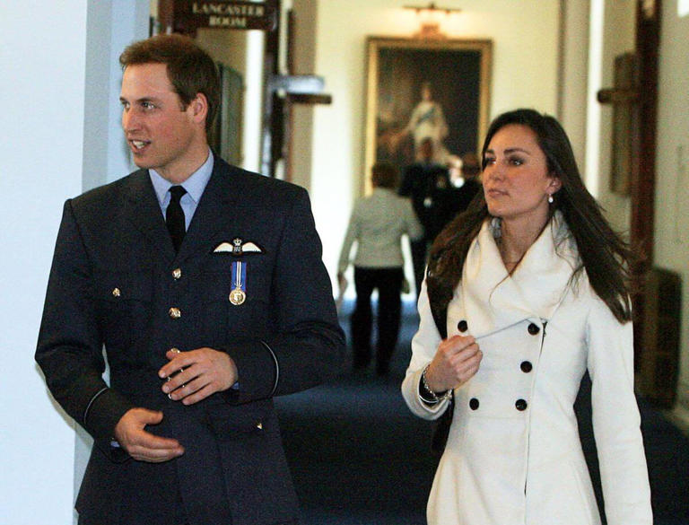 Prince William and Kate Middleton walking together at the Central Flying School in Lincolnshire, England | POOL/Tim Graham Picture Library/Getty Images
