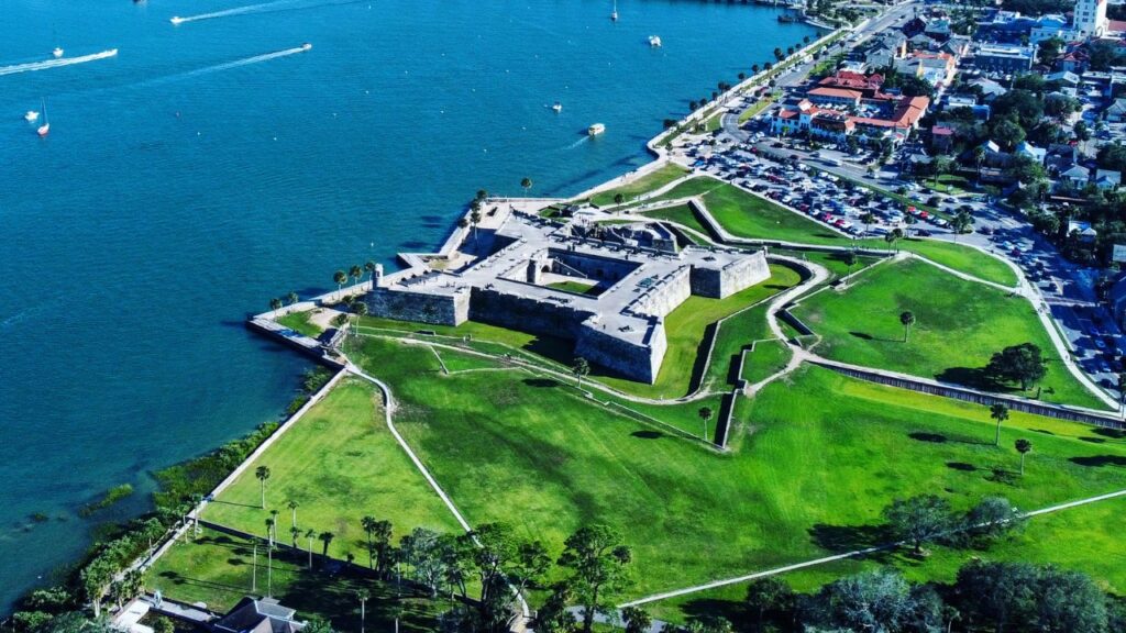 <p>The Castillo de San Marcos National Monument is a remarkable example of 17th-century military architecture and is the oldest masonry fort in the United States. </p><p>Constructed by the Spanish between 1672 and 1695, this historic fortress is made from coquina, a unique sedimentary rock composed of compressed seashells, which has endured centuries of battles and sieges. </p><p>The fort's history includes periods of control by the Spanish, British, and Americans, reflecting the region's tumultuous past. Today, it is a popular tourist attraction, offering a glimpse into St. Augustine’s storied past.</p><p>Pro Tip: Some have reported seeing Spanish soldiers and orbs in photos taken at Castillo de San Marcos at night, so be sure to snap some photos!</p>