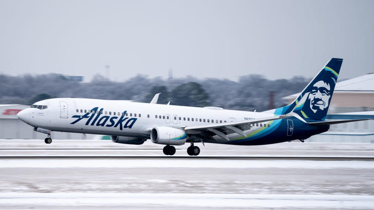 An Alaska Airlines plane lands at Nashville International Airport in Nashville on Feb. 16, 2021.