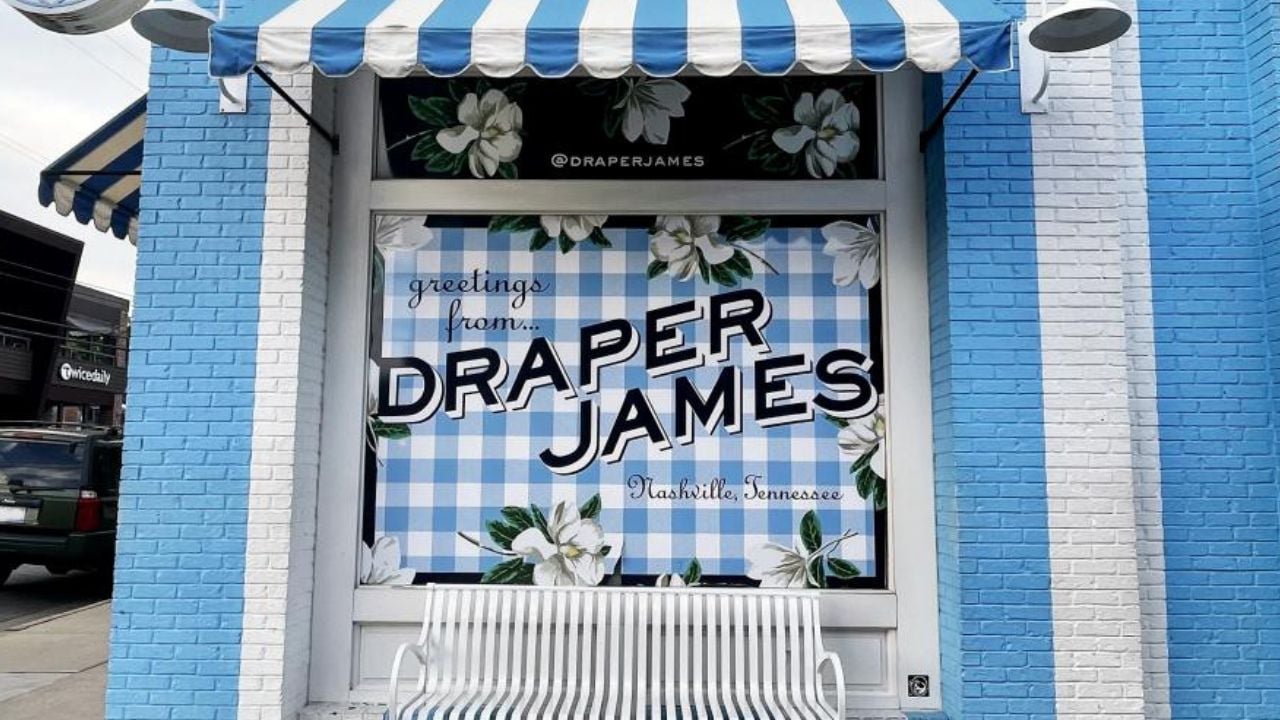 <p>With nearly one million followers on Instagram, the Draper James clothing company, founded by Reese Witherspoon, has a mural of its own that folks love to take photos with. Just outside the shop, you’ll find the blue and white gingham mural, plus a bench to pose on.</p>