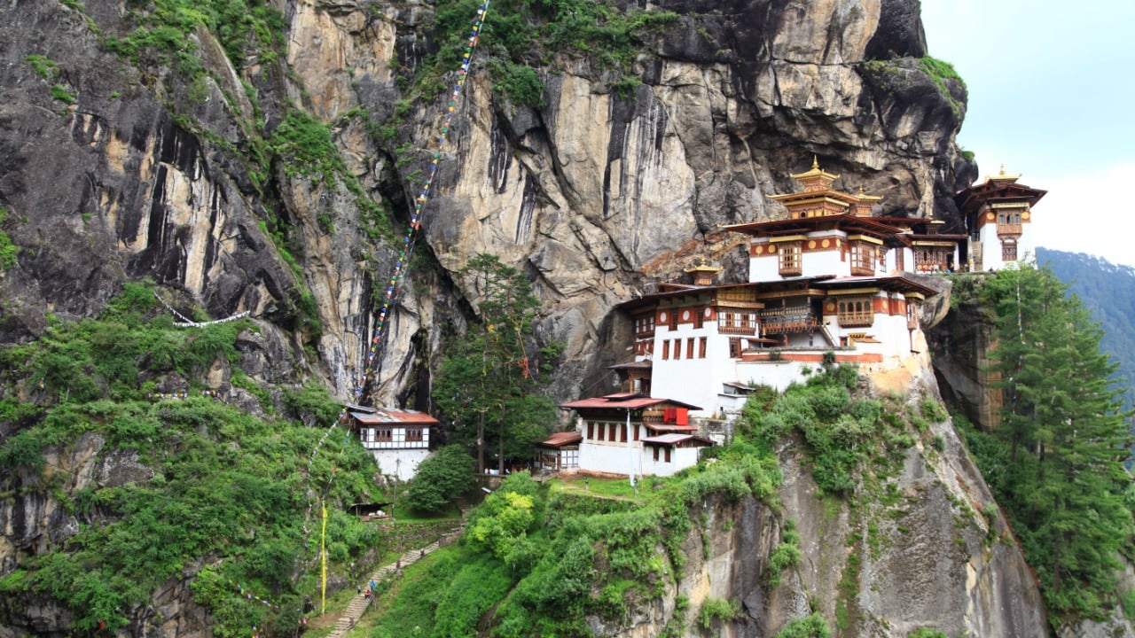 <p>Bhutan will cost you about $90 every day, including food, accommodation, and all other expenses. When you first step into the country, you’ll notice the Bhutanese architecture, which is almost like a blend of Tibetan, Indian, and Nepalese landmarks.</p><p>You can also see the mesmerizing handicrafts at the Choki Traditional Art School, which will leave you stunned by their sheer beauty.</p>
