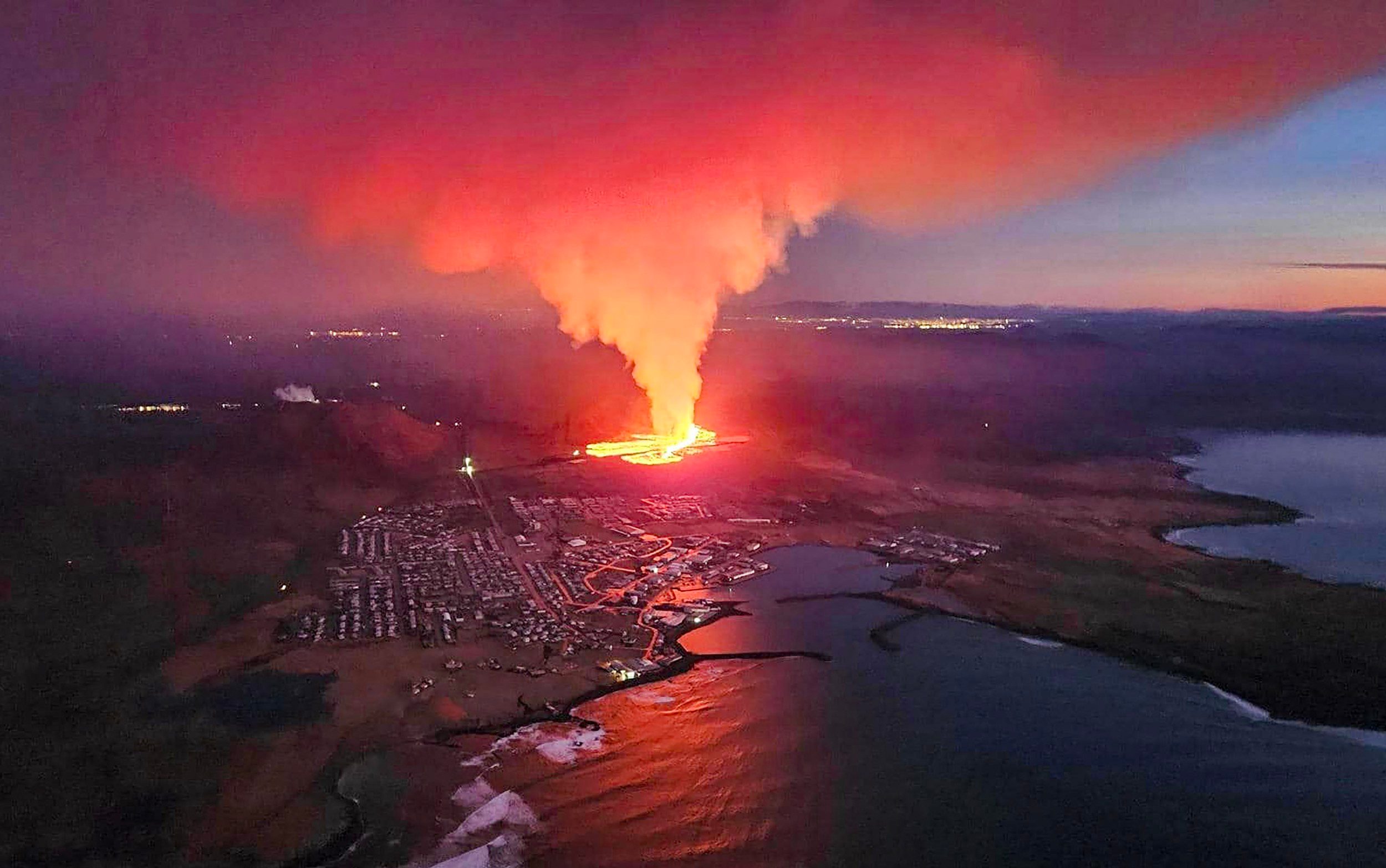 volcano erupts in iceland again cracking defences of fishing town
