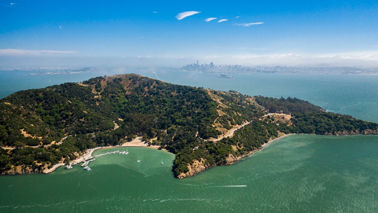 <p>The Angel Island Perimeter Loop is one of the best hiking trails in California and a unique <a href="https://wealthofgeeks.com/outdoor-things-to-do-in-san-francisco/" rel="nofollow noopener">thing to do while visiting San Francisco</a>. Located on Angel Island in the San Francisco Bay, the trek encircles the island, offering gorgeous views of the bay and neighboring lands. To get here, hop on either the Golden Gate Ferry from San Francisco or the Angel Island Tiburon Ferry from Marin County ($15.50 and $18.00, respectively).</p><p>Once on the island, pick up a map at Alaya Cove to guide you in exploring the remote island. After the hike, stop at the park museum to learn more about the island’s storied past. </p>