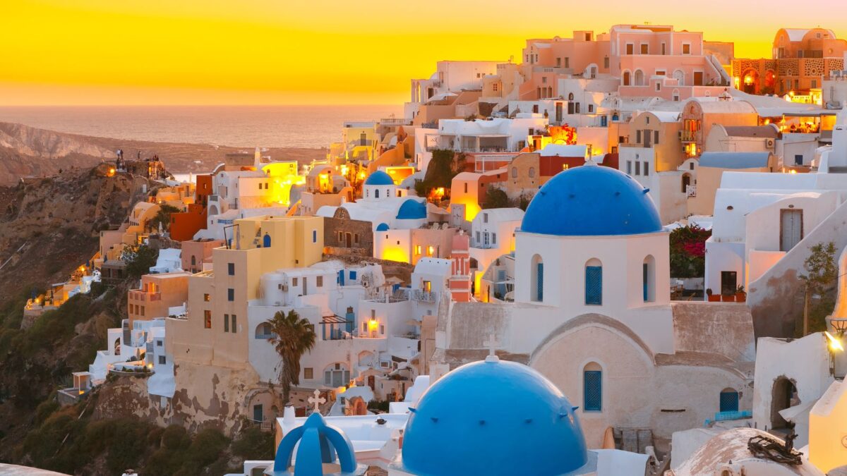 <p><a href="https://www.flannelsorflipflops.com/santorini-cruise-port/">Santorini</a> is known for its stunning sunsets, white buildings with blue domes, and the Aegean Sea. </p>