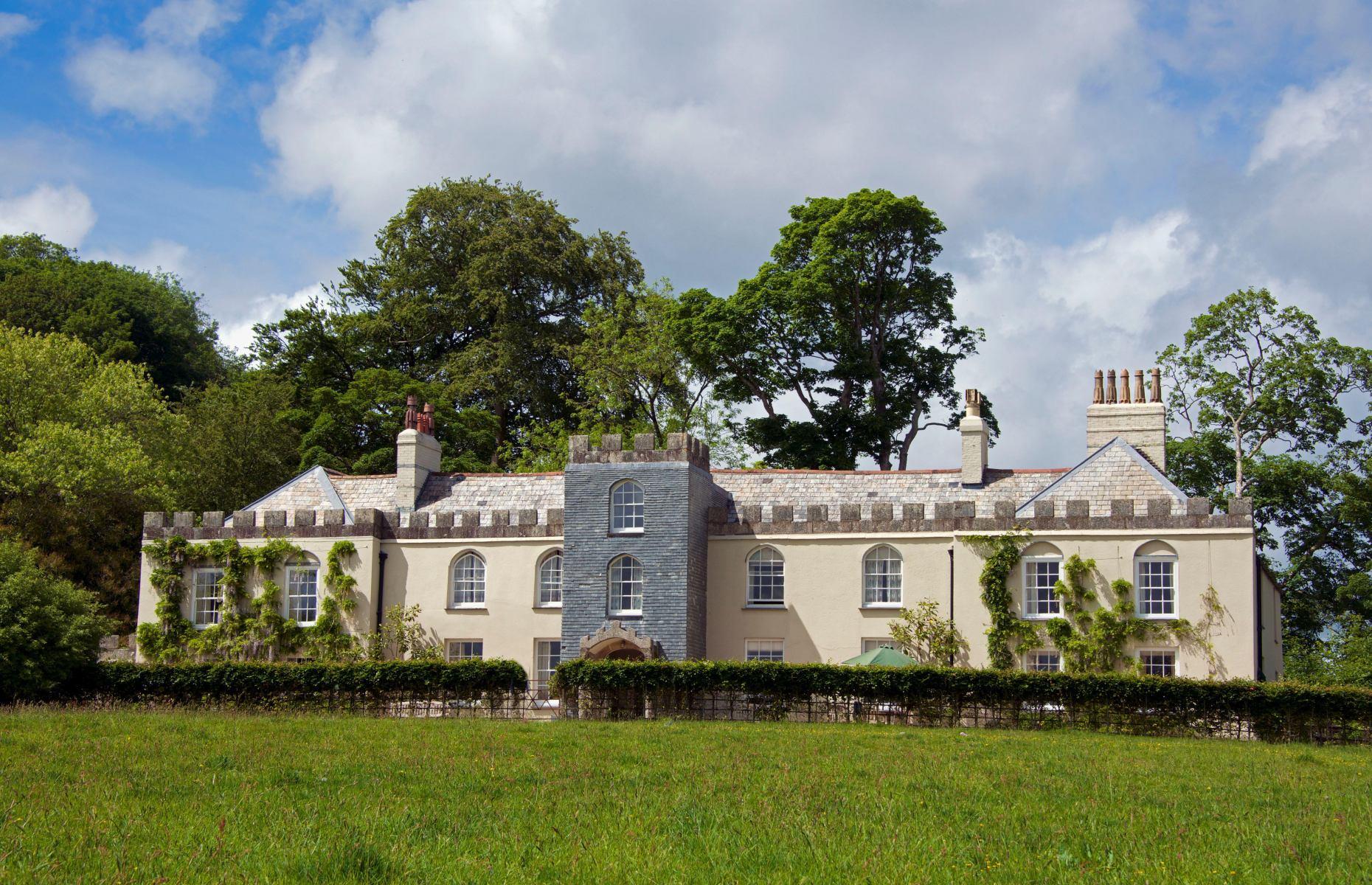 <p>Nestled in the heart of the Fowey Valley in Cornwall, Restormel Manor is an elegant 1540s manor house that was restored in the 18th century. While it remains the official residence of King Charles lll and Queen Camilla when they are in the county, it is available to rent as part of the <a href="https://www.duchyofcornwallholidaycottages.co.uk/properties/restormel-manor">Duchy Estate</a> at other times.</p>  <p>The Strawberry Hill Gothic-styled mansion, with its crenellated façade, lies in the shadow of a 13th-century castle and in Cornish 'Restormel' means 'King’s Tower Hill.'</p>