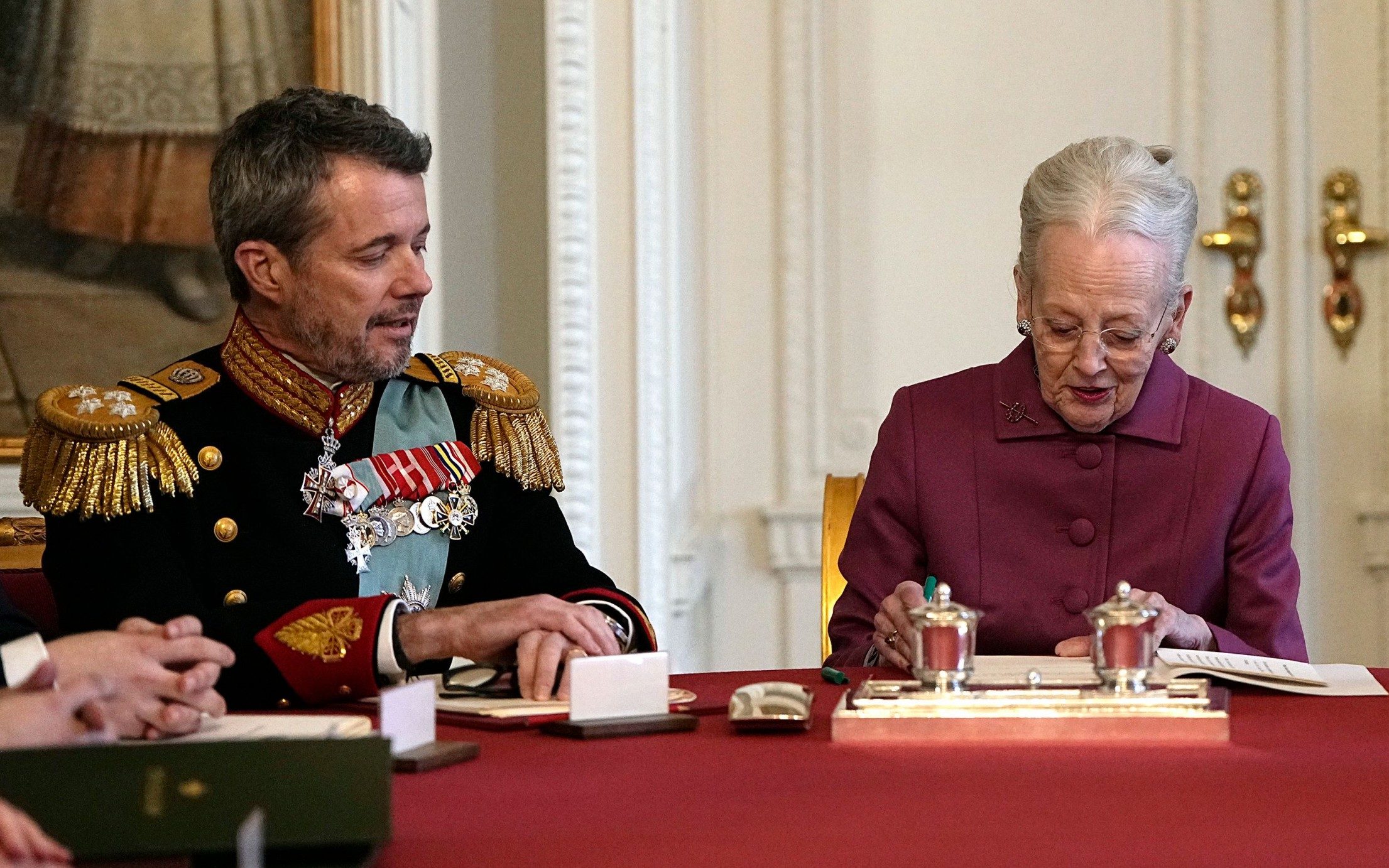 new danish king seals accession with awkward kiss on palace balcony
