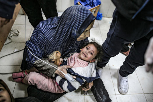  Injured Palestinians, including children are taken to the Nasser Hospital following an Israeli strike on the house of the Abu Aram family in Khan Younis, Gaza, on Jan. 12, 2024. (Jehad Alshrafi / Anadolu via Getty Images)