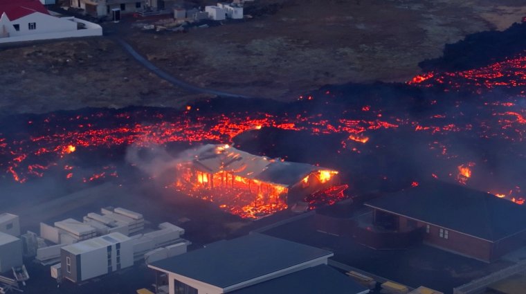 iceland volcano eruption in pictures as lava flow sets homes ablaze