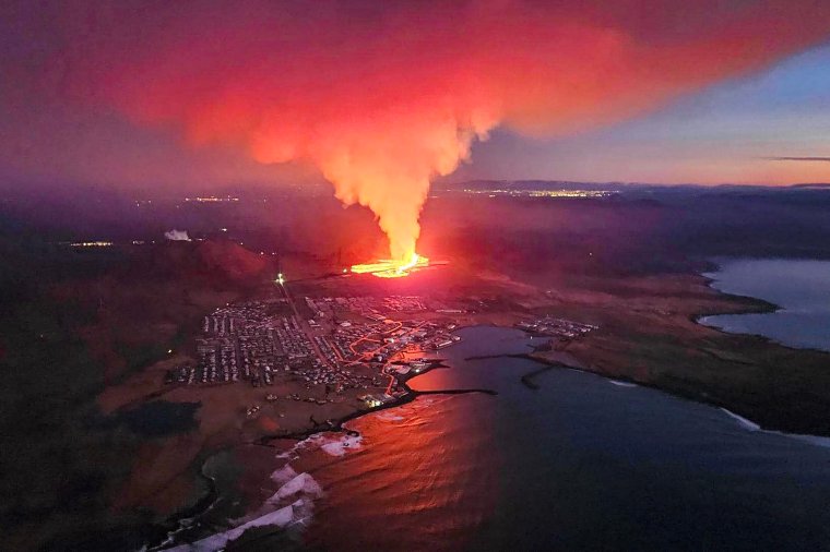 iceland volcano eruption in pictures as lava flow sets homes ablaze