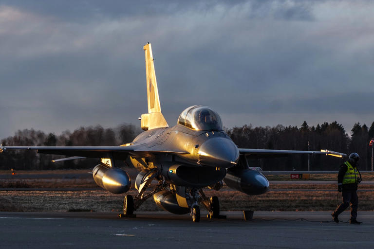 An F-16 aircraft is pictured after the first delivery of Norway's old F-16 fighter aircraft to Romania at Rygge Air Force Base, Norway on November 28, 2023. Although unlikely to dramatically alter the war on their own, the dozens of advanced aircraft pledged by Kyiv's backers will furnish Ukraine will a new set of capabilities to threaten Moscow's air superiority.