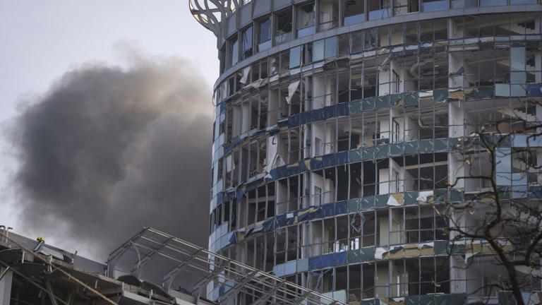 Smoke rises from a building damaged in Russia's missile attack in Kyiv, December 29, 2023. - Efrem Lukatsky/AP