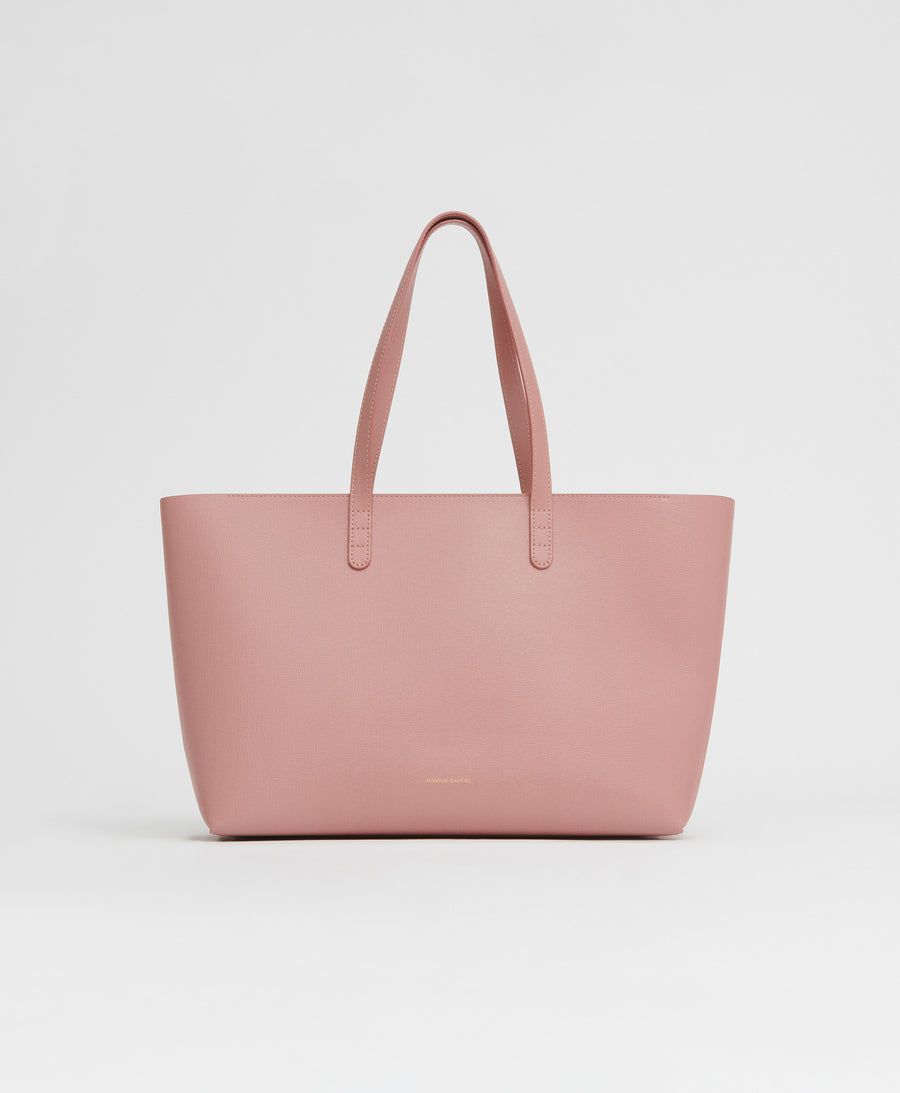 <p><strong>$545.00</strong></p><p><a href="https://go.redirectingat.com?id=74968X1553576&url=https%3A%2F%2Fwww.mansurgavriel.com%2Fproducts%2Fsmall-zip-tote-confetto-1%3Fvariant%3D40570263601225%26gad_source%3D1%26gclid%3DCjwKCAiApuCrBhAuEiwA8VJ6Jmpu-pWk95qlh3yKzAwqgMnqzafXzGu8bbj50prVdFevZHn_P-oCqBoCljYQAvD_BwE&sref=https%3A%2F%2Fwww.harpersbazaar.com%2Ffashion%2Ftrends%2Fg46115829%2Fbest-travel-purse-for-women%2F">Shop Now</a></p><p>Mansur Gavriel's zip tote is made with gorgeous saffiano leather and decorated with a pastel pink hue that is beyond charming. The dimensions are just large enough to carry travel necessities like a passport holder, snacks, and a guidebook without weighing you down. With seven other shades to choose from, perhaps you might even consider purchasing more than one.</p><p><strong>Dimensions:</strong> 10"H x 12.5"W x 4"D.</p><p><strong>Material: </strong>Leather</p><p><strong>Colors: </strong> Cream, beige, blue, pink, red, burgundy, green, multicolored</p>