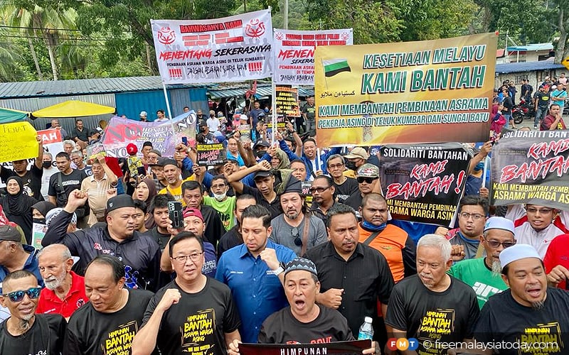 residents protest against dorms for migrant workers in teluk kumbar