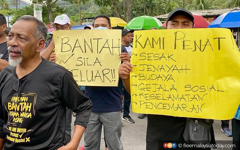 residents protest against dorms for migrant workers in teluk kumbar