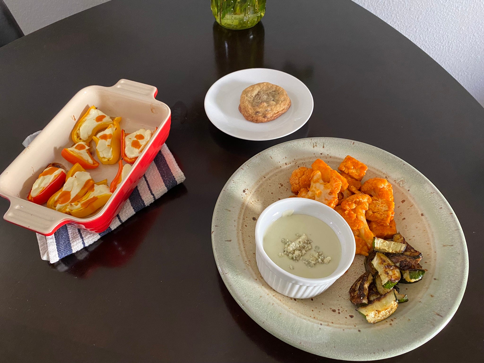 <p>On day seven, I had plans with a friend so my final three-course meal was a little early.</p><p>I went with a game-day theme of cream-cheese-stuffed bell peppers, Buffalo cauliflower and tofu with a side of blue-cheese dipping sauce and zucchini, and my <a href="https://www.insider.com/which-famous-chef-has-the-best-chocolate-chip-cookie-recipe">favorite chocolate-chip cookies</a> for dessert.</p><p>I winged the cream-cheese-stuffed peppers but realized I should've followed a recipe, as they turned out quite bland.</p><p>Thankfully, the entrée made up for the lackluster app.</p><p>Of course, the chocolate-chip cookies were also a hit, but this is a dessert I make often. I knew I could count on them for a good end to the week.</p>