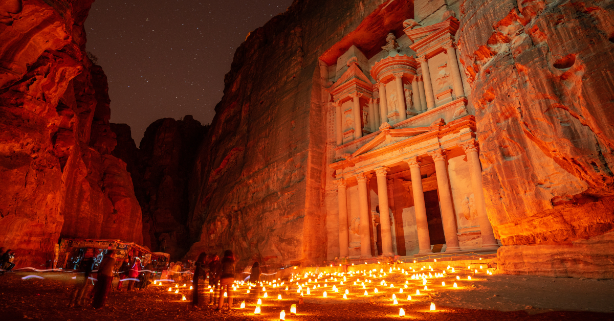 <p> Few experiences compare to the feeling of walking through the Siq and emerging to see the splendor of the Treasury towering before you.  </p> <p> That’s just one of the carved red structures that await you in Petra, which was a Nabatean hub from the 4th century BCE through the early common era. </p> <p> While getting to Petra isn’t cheap, the village of Wadi Musa has many affordable shops, hotels, and cafes for your hospitality. </p>