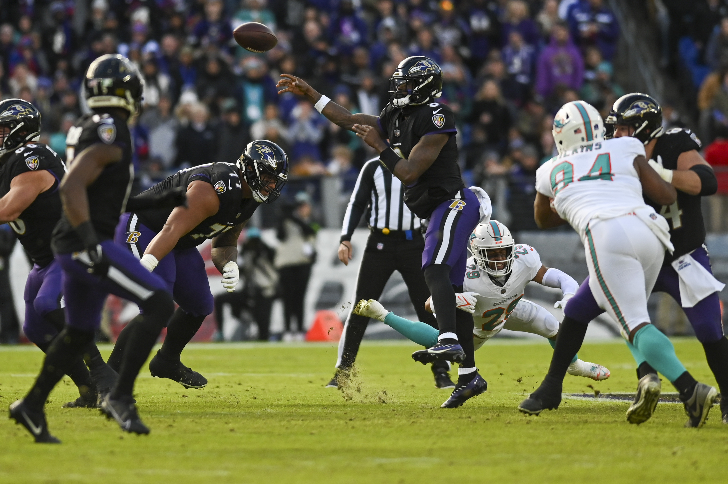 ravens dominate dolphins, clinch no. 1 seed in afc