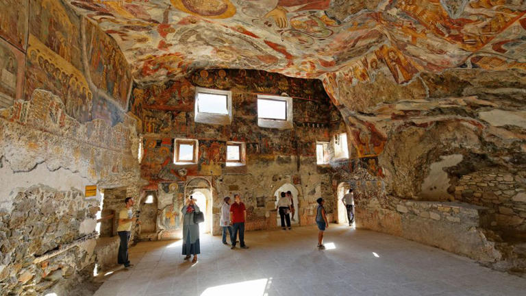 Frescoes cover the interior of the Rock Church at Sumela Monastery in Turkey's Black Sea region. - imageBROKER.com/Alamy