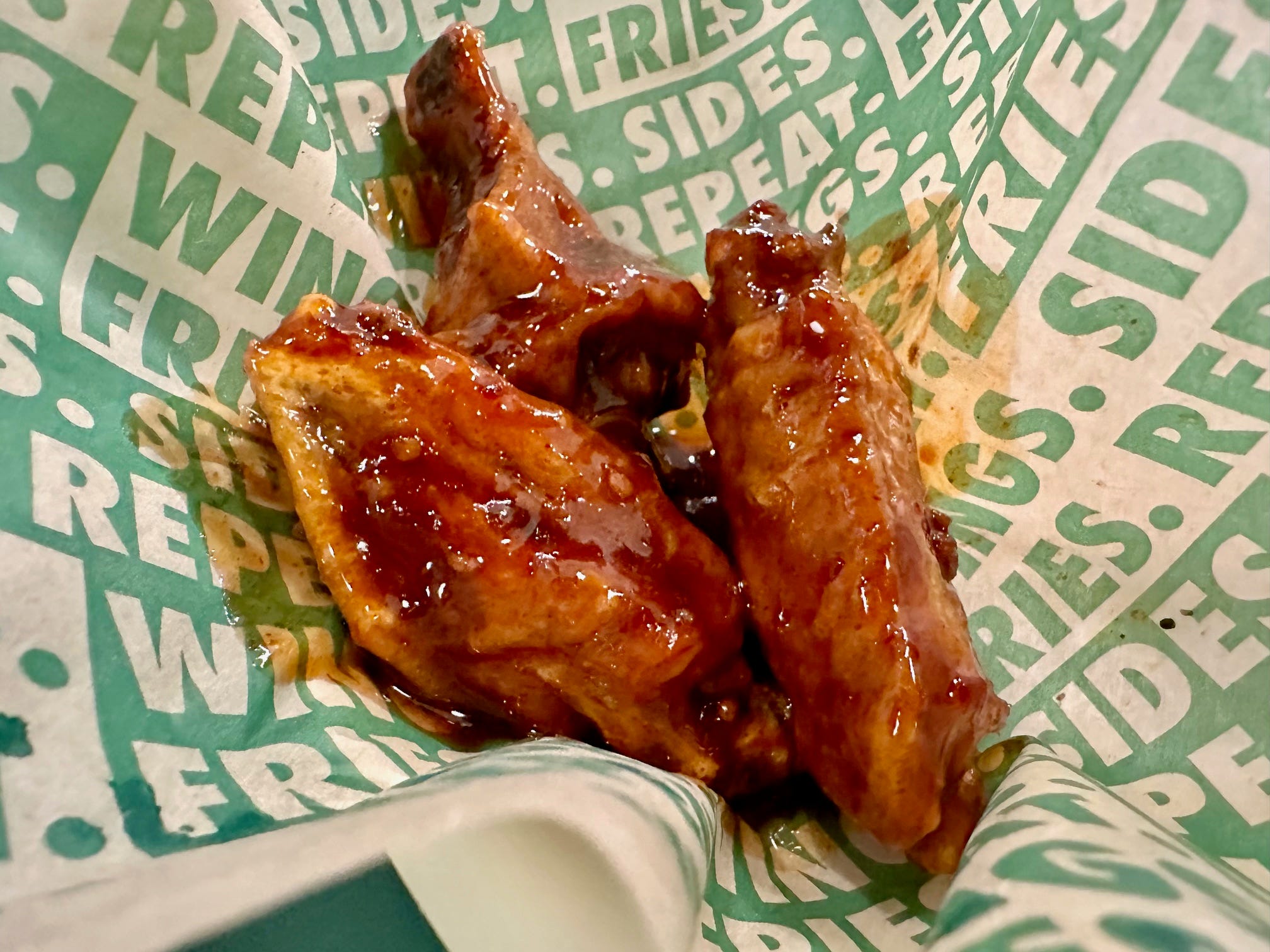 <p>The Spicy Korean Q wings are described on Wingstop's menu as a "sweet and spicy" wing made with ginger, garlic, sriracha, and crushed red pepper.</p><p>The heat level is three flames out of five on the Wingstop scale.</p><p>It was nearly identical in taste to Popeyes' Sweet 'N Spicy wings.</p><p>But the Popeyes Sweet 'N Spicy wing had more heat and bolder flavors.</p><p><strong>Winner: Popeyes.</strong></p>