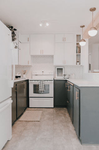 gray-blue and white kitchen with brass