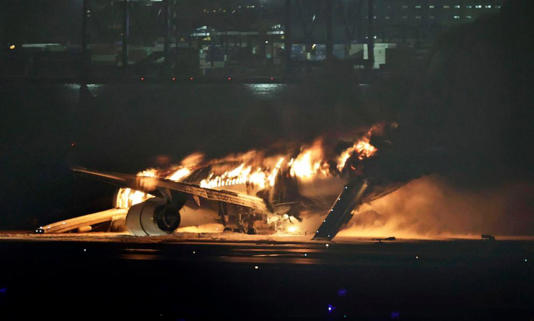 A Japan Airlines plane is on fire on the runway of Haneda airport on Tuesday, Jan. 2, 2024 in Tokyo, Japan.