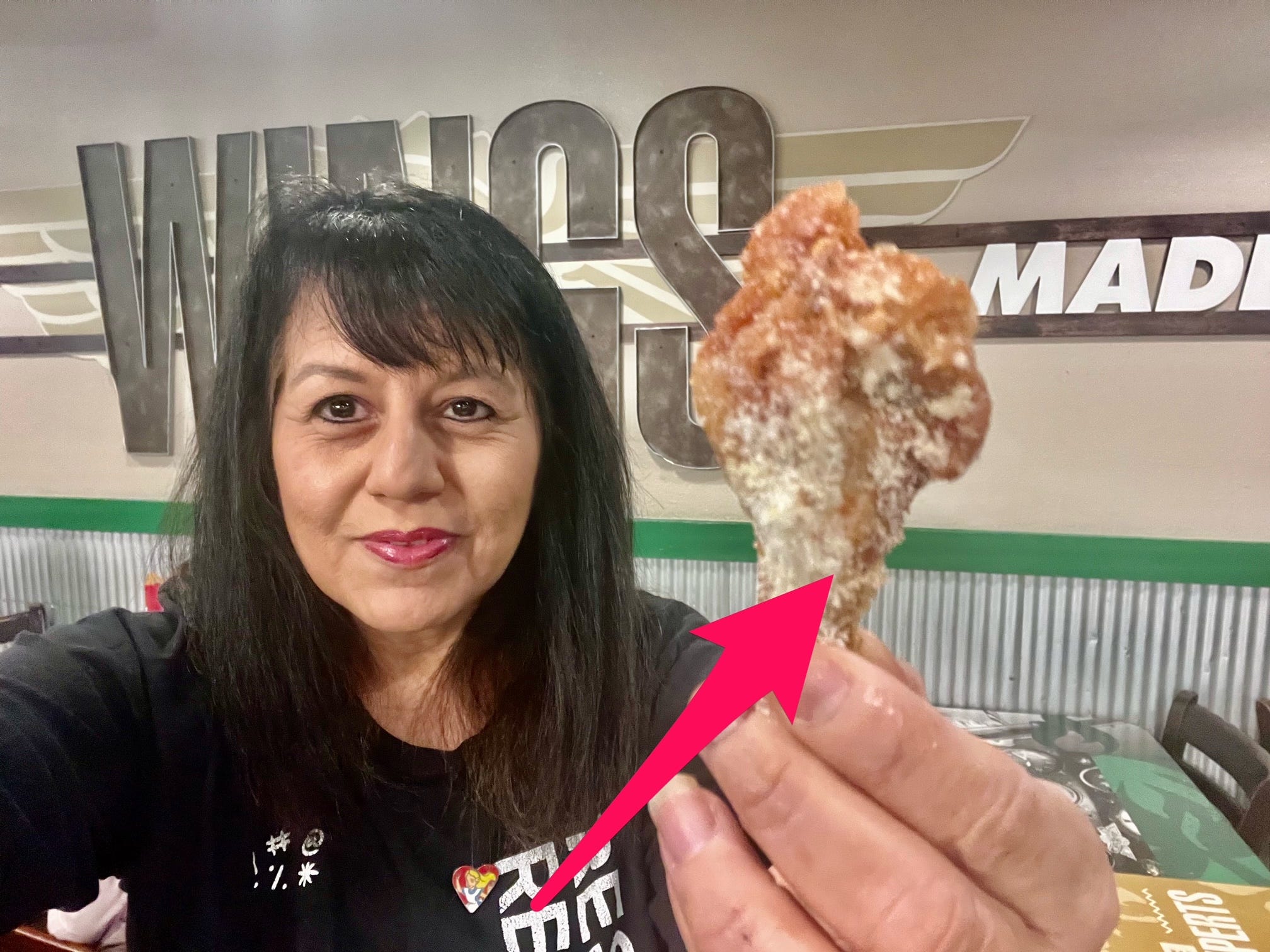 <p>The Parmesan cheese was clearly dusted on top of the wing with a shaker. At Popeyes, the cheese was part of the sauce, so you could taste it with every bite.</p><p>The Wingstop wing doesn't have thick breading, so it had no crunchy texture like Popeyes. The clumpy grated cheese barely clings to the wing. Half of the Wingstop grated cheese fell to the table or on my shirt.</p><p><strong>Winner: Popeyes</strong></p>