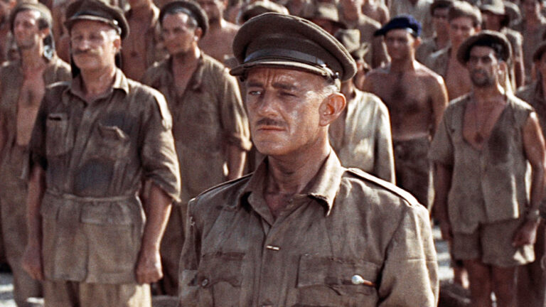 <p>We know, war movies aren’t typically delightful, but most aren’t as deft and transfixing as <em>The Bridge on the River Kwai</em>, a movie that never follows the course you expect. </p> <p>The war of wills between captured British P.O.W. Colonel Nicholson (Alec Guiness) and his honorable captor, Colonel Saito (Sessue Hayakawa) is fascinating enough - both men are masterfully written and acted characters, and director David Lean shows stellar show-don’t-tell restraint that is, well, captivating. </p> <p>But then the film layers on the story of the charming Shears, William Holden, and you have one of the most layered yet elegant war movies of all, with a <a href="https://www.youtube.com/watch?v=pV472RktExA" rel="noopener">theme</a> you’ll be whistling for weeks. For our money this is the best of the war movies of the 1950s.</p>