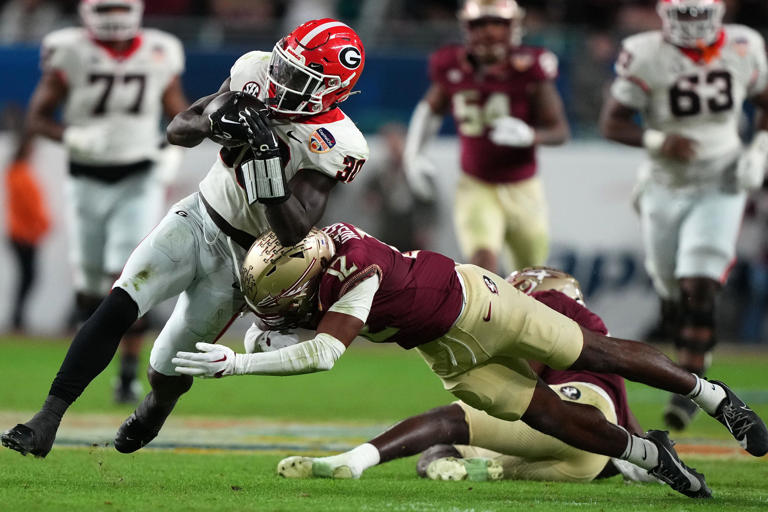 U.S. Navy SEAL Team 10 member DJ Shipley speaks to FSU football