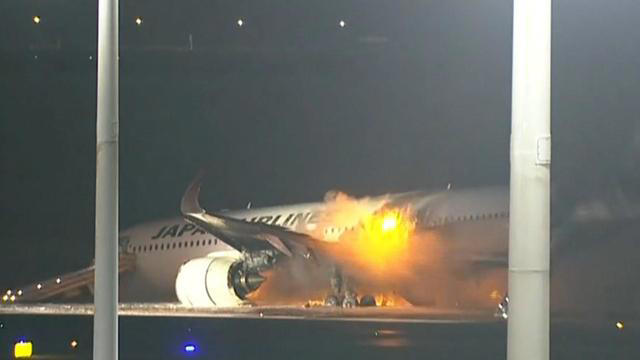 Japanese Airlines plane bursts into flames after collision with coast ...