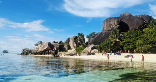Smooth granite boulders and swaying palms give Anse Source d'Argent in the Seychelles its distinctive look.