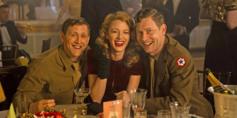 Adaline (Blake Lively) drinking with two Army recruits in The Age of Adaline