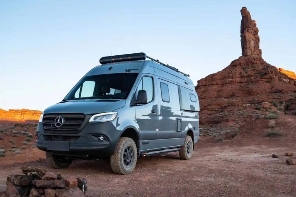 <p>The Winnebago Revel is a close competitor with Storyteller Overland’s vans. The main difference between the two is the Winnebago is a Class B RV with an enclosed toilet and shower.</p><p>This van is the clear choice for someone wanting a campervan with a bathroom. However, it does take up a lot of space in the <a href="https://www.thewaywardhome.com/sprinter-van-conversion-kits/">Sprinter van</a>, making it not as roomy and open.</p><p>The power lift bed is another unique part of the Winnebago Sprinter camper van. You can totally lift the bed to the ceiling during the day for an open space and easier access to your van’s “garage.”</p><p>Like the Storyteller, the <a href="https://www.thewaywardhome.com/storyteller-overland-vs-revel/">Winnebago Revel</a> has a full kitchen with a sink, induction cooktop, and fridge.</p>