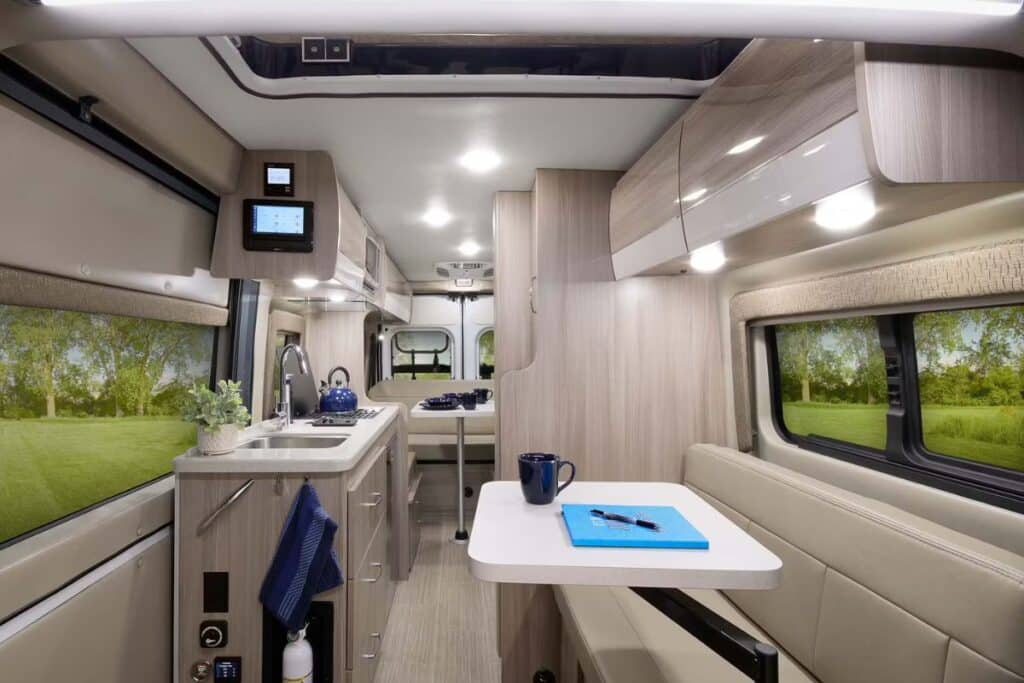 <p>The Thor Motor Coach Sequence is a luxury camper van for couples who prefer a spacious interior to a big bathroom.</p><p>The kitchen has<a href="https://www.thewaywardhome.com/campervan-kitchen-essentials/"> all the essentials</a>, while the dinette is super cozy. The bathroom is compact but big enough to have a nice warm shower after a day spent adventuring. At the back of the van, you’ll find the king-size sleeping area, which needs to be assembled at night.</p><p>The Sequence comes equipped with a bike rack and patio awning. If you like, you can add a pop-top SkyBunk to add a separate bedroom to the floor plan.</p>