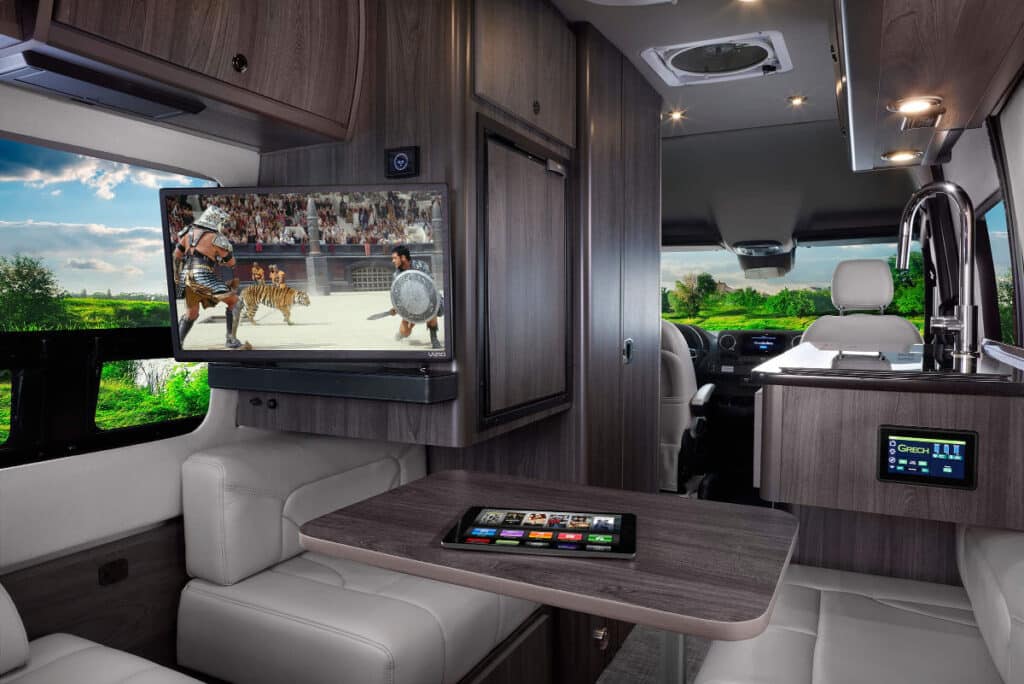 <p>The Grech RV Turismo-ion camper van packs a lot of luxuries in only 19 feet. It features a big sofa bed, a wet bath, and a luxurious-looking kitchen.</p><p>We haven’t seen a porcelain toilet and power window shades on any other van that’s on the market.</p><p>When it comes to choosing a luxury camper van, it’s all in the little details. There are so many out there by now. Well done, Grech RV.</p>